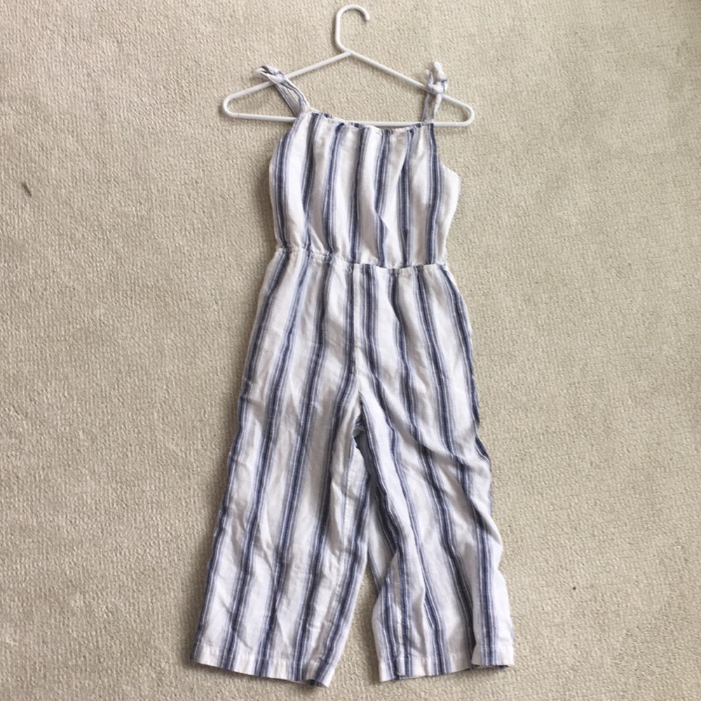 A blue and white kids jumper. It was worn once